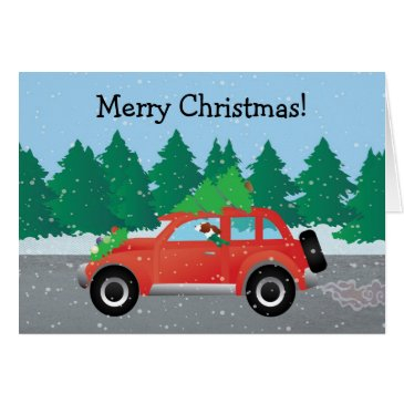 irish red and white setter driving christmas car