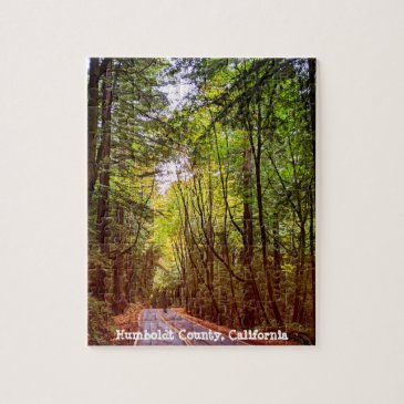 wet road through green trees in humboldt autumn jigsaw puzzle